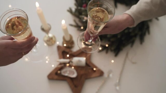 Two Women with glasses of champagne celebrate Christmas. Happy New Year