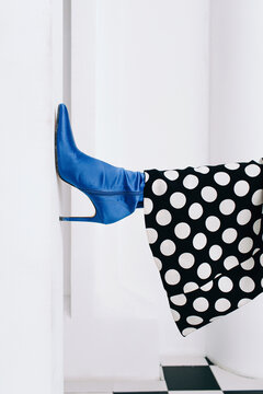 Leg of woman in blue shoe - Fashion detail