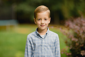 Portrait of a young boy in a button up shirt