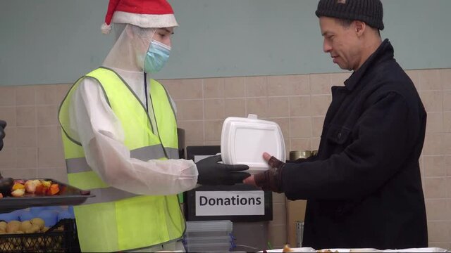 Volunteers on Christmas Day or Christmas Eve. Homeless shelters and soup kitchens.