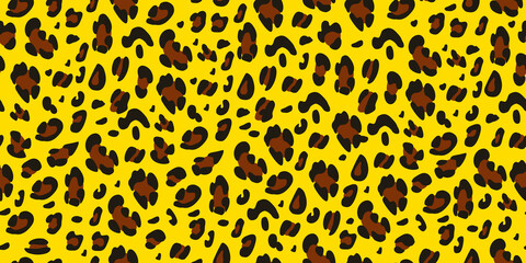 Leopard print on a yellow background. Seamless animalistic pattern.Vector hand-drawn background