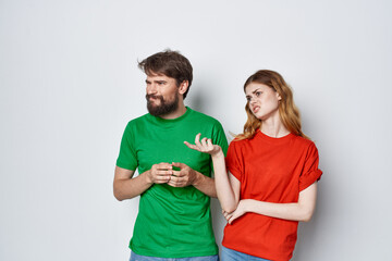 Fototapeta premium man and woman hug friendship colorful t-shirts family light background
