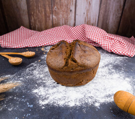 black round bread on a dark table