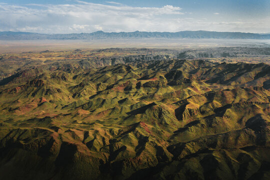 Rock formations And Rugged Mountains In Kazakh Steppe