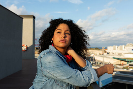 Relaxed latin woman on rooftop