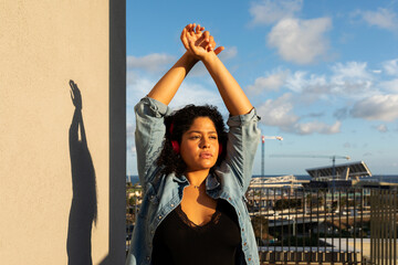 Curvy woman recreating at rooftop