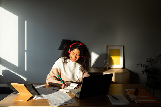 Hispanic woman working in office