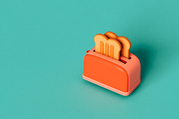 red Toaster with toasted bread on blue with copy space.