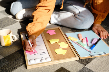 Writing down weekly plan on blackboard