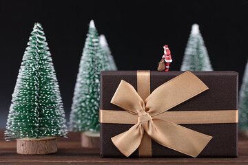 Santa on a miniature world gift box