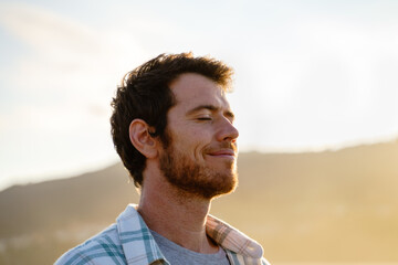 Portrait of relaxed man at sunset