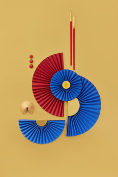 Origami fans, fortune cookie and chopsticks