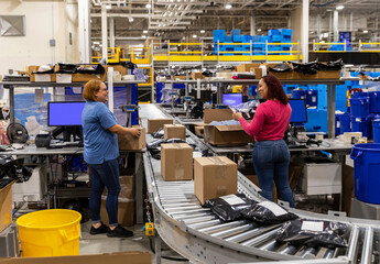 Workers talking atWork Station at E-commerce warehouse