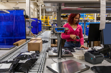 Worker and Conveyor Belt at E-commerce warehouse