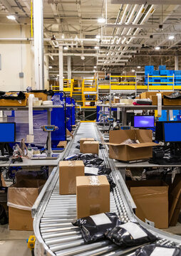 Conveyor belt with packages for shipment at warehouse