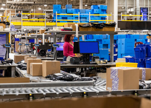 Boxes on conveyor belt at shipment facility