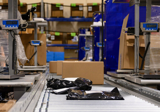 E-Commerce Warehouse with boxes and bags being shipped 