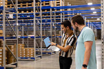 Two Managers having meeting in warehouse workplace  