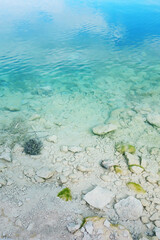 Transparent turquoise sea water, seabed. Blue surface, clear water.