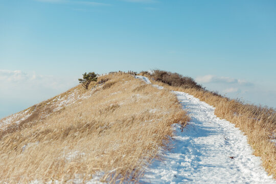 A mountain path covered with snow.