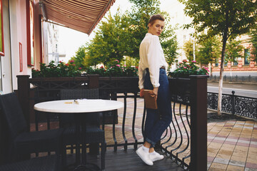 short haired woman on the street vacation in the city summer education