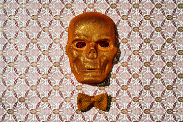 golden glitter skull mask and bowtie