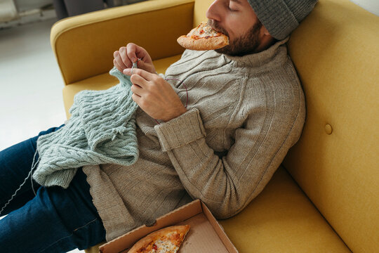 A young crafty man at home.