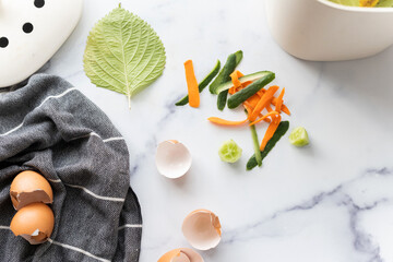 Food scraps on table near compost