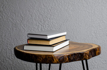 Book on a wooden table. A stack of books on the table. Studies.