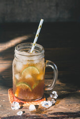 ice lemon tea in the glass with lime slices