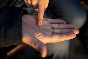Anonymous Grandchild Pointing Grandfather Hand