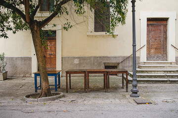 Old tables on shabby street