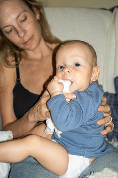 Teething Baby And Mother