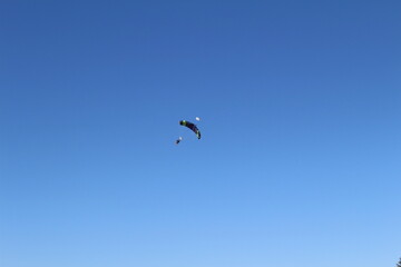 Naklejka na ściany i meble parachute in the sky
