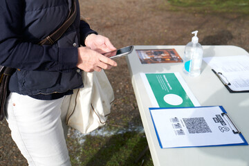 Covid QR code check-in point at outdoor market