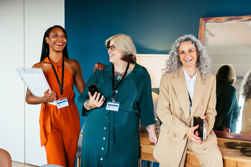 Cheerful diverse women in office