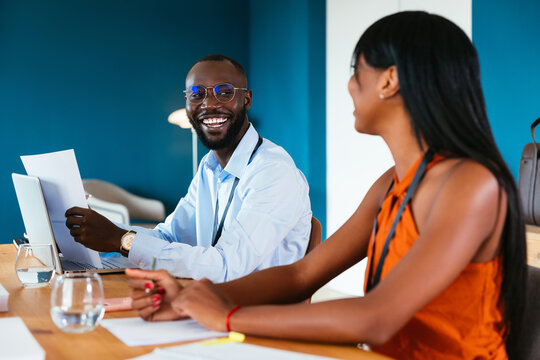 Optimistic black coworkers in office