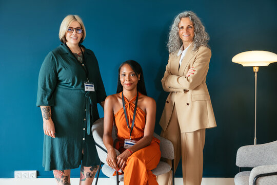Positive diverse businesswomen in office
