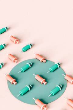 3d render of syringes in a row on pink background