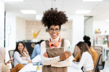 Portrait of business black woman with cell