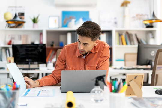 Young businessman working at office