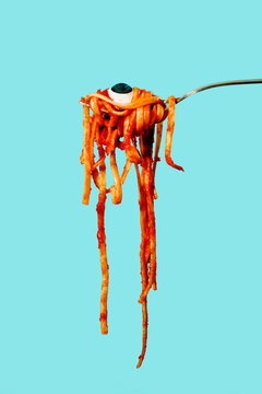 tagliatelle alla bolognese and eye in a fork