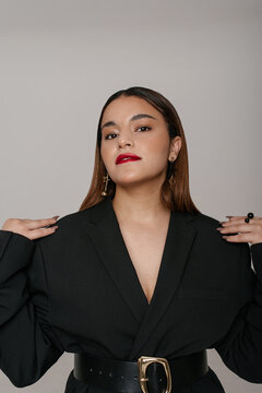 Outstanding girl with red lipstick in a black jacket