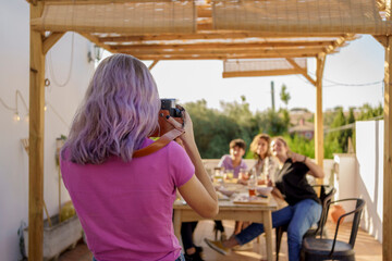 Teen friends instant photo in a party