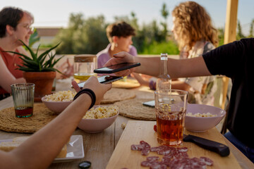 Detail of teenagers sharing wifi