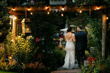 A Bride and Groom Walk into Their Wedding Reception