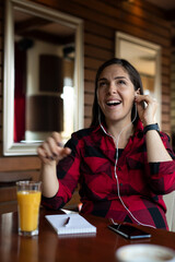 A beautiful young woman is working in the cafe