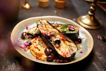 
Grilled eggplant with red beans and pomegranate served on sweet potato puree. Jewish kosher dish.
Culinary photography. Suggestion to serve the dish.