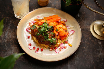 Lamb stew with groats and carrots.
  Jewish kosher dish.
Culinary photography. Suggestion to serve the dish.