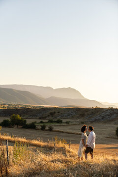 Couple In Countryside At Sunset
